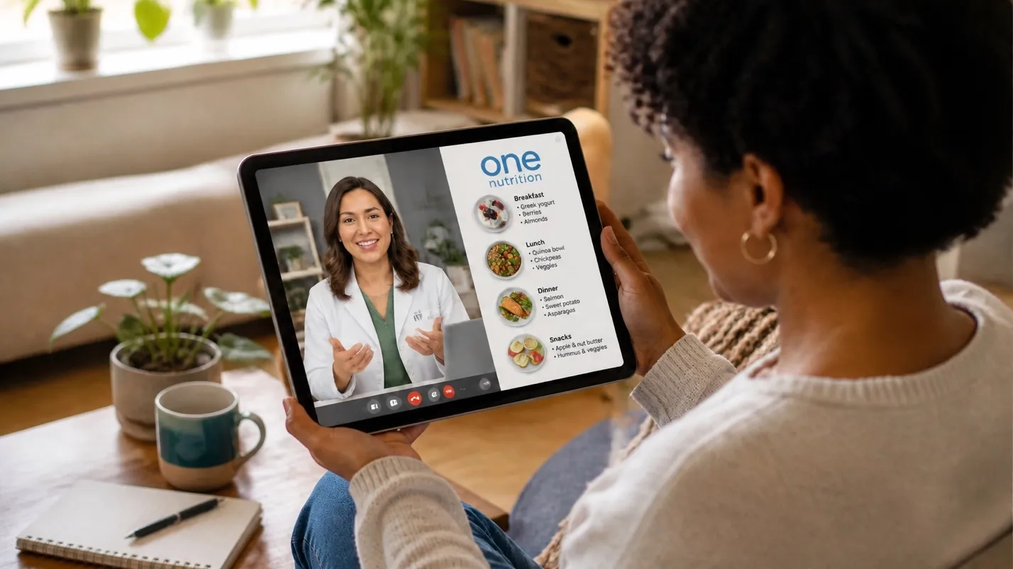 Patient reviewing a personalized ONE Nutrition meal plan with breakfast, lunch, dinner, and snacks during a virtual visit